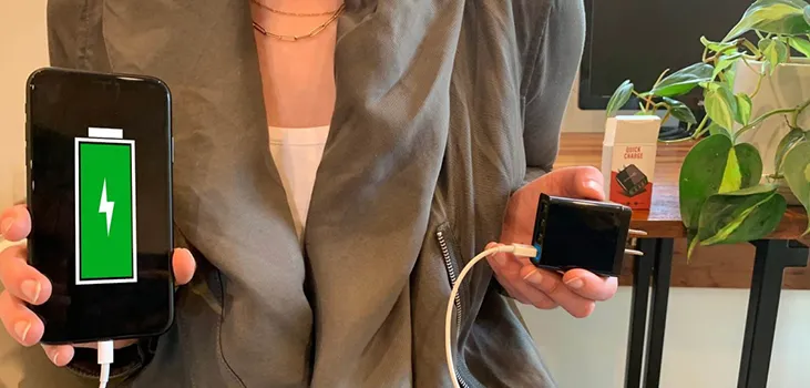 woman holding QuickChargePro and her mobile
